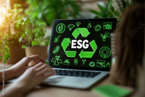 Eco-Friendly Leadership and Selection in ESG Strategies with Laptop in an Environmentally Themed Workspace Surrounded by Green Elements photo