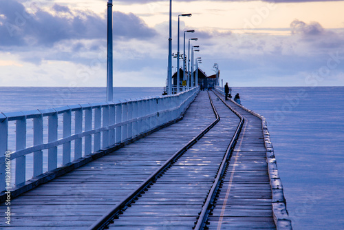 The last section of the Busselton Jetty with its rail line and timber structure. photo