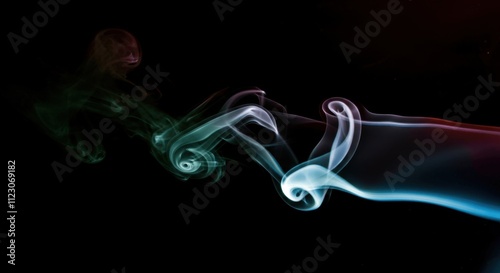 Colorful smoke swirls on black background