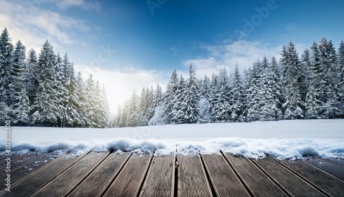 winter christmas scenic landscape with copy space wooden flooring strewn with snow in forest with fir trees covered with snow on nature