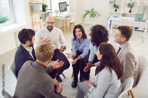 Young addict people talking on group therapy meeting, sitting in circle, discussing addiction, mental health problems, counselor speaking, giving support and advice to team for project, sharing ideas photo