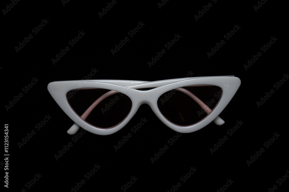 white frame cat eye sunglasses on black background