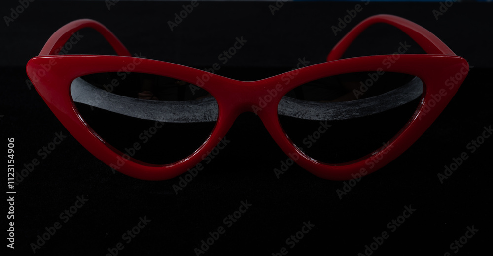 Red cat eye sunglasses isolated on cat eye sunglasses on black background