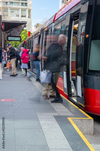 Embarking and disembarking light rail public transport in Sydney photo