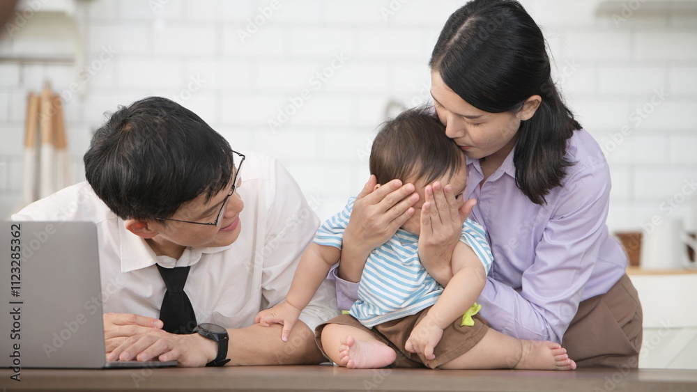Parents and son play together after dad comes home from work Parents and son play together after dad comes home from work