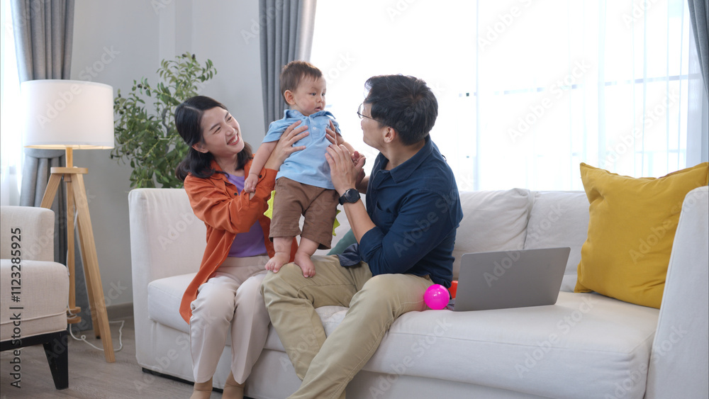 Parents and son play together after dad comes home from work Parents and son play together after dad comes home from work