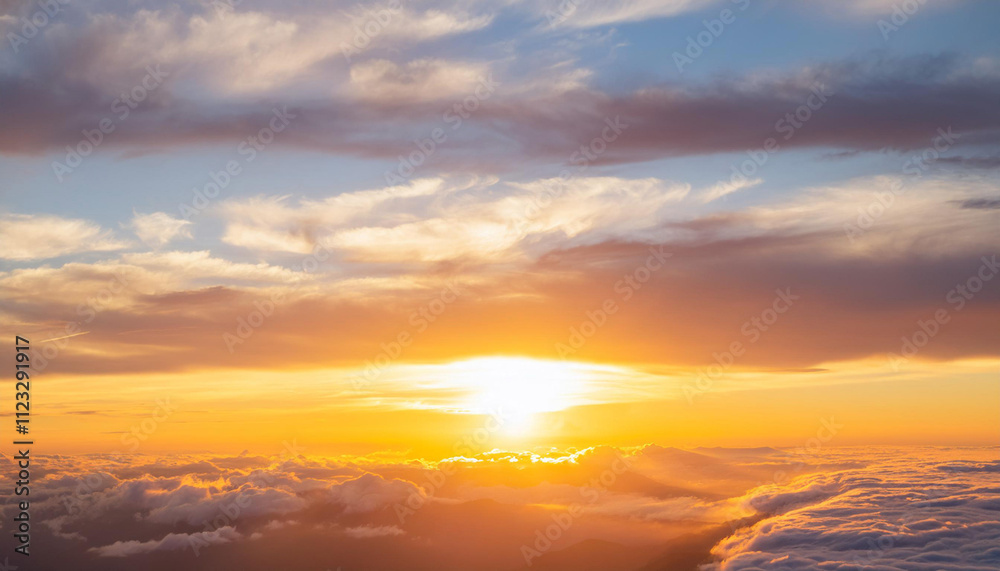 Obraz premium Sun Setting Over Clouds in Sky and Copy Space