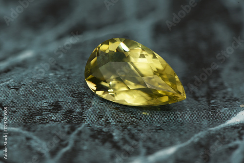 golden yellow citrine gemstone, on a black-white backgrond black-white marble