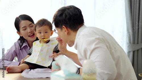 Asian baby and families who have to work while raising children at home