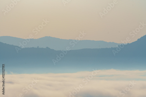 Quadro em tela serene landscape featuring soft, layered mountains shrouded in mist, creating tranquil atmosphere