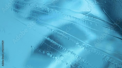 Macro shot of ice in a blue winter sky. Close-up of an icy surface.