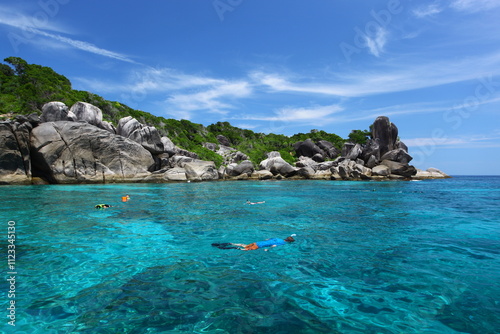 Snorkeling in crystal blue water in Similan Islands Marine National Park, Phang Nga Province, Southern Thailand  photo
