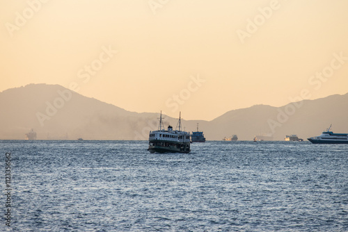 Hong Kong Star Ferry Navigating the Harbor at Sunset