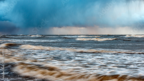 Принти на полотні dramatic storm in the Baltic Sea, large waves crashing against the shore, blurre