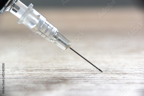 Obraz na płótnie Detail of medical needle on wooden table w salonie