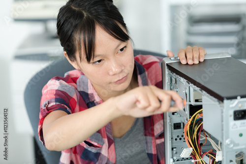 Wallpaper Mural female asian technician working on computer Torontodigital.ca