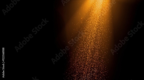 Golden light rays illuminate sparkling particles against a dark backdrop in a...