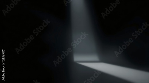 Light beam cutting through darkness in an empty space at night creating a mys...