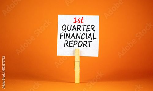 1st quarter financial report symbol. Concept words 1st quarter financial report on beautiful white paper. Beautiful orange background. Business 1st quarter financial report concept. Copy space. photo