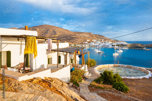 Fototapeta Naklejka Na Ścianę i Meble -  Traditional style Greek apartments at sunrise in Karavostasis port, Folegandros island, Cyclades, Greece