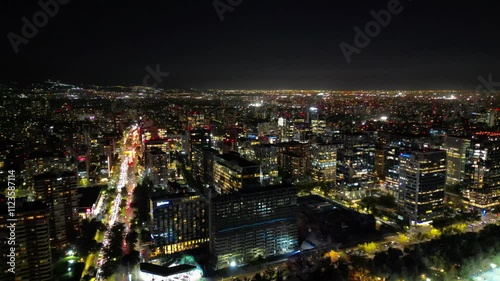 Aerial Night View of Cityscape with Brightly Lit Streets and Buildings