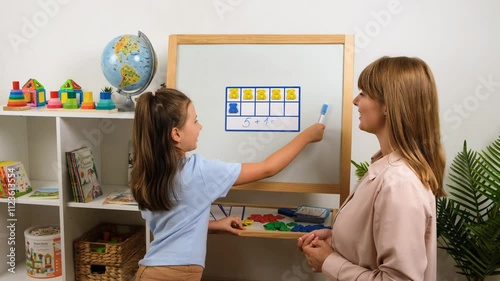 Girl Learning Math with Teacher and Colorful Bear Counters