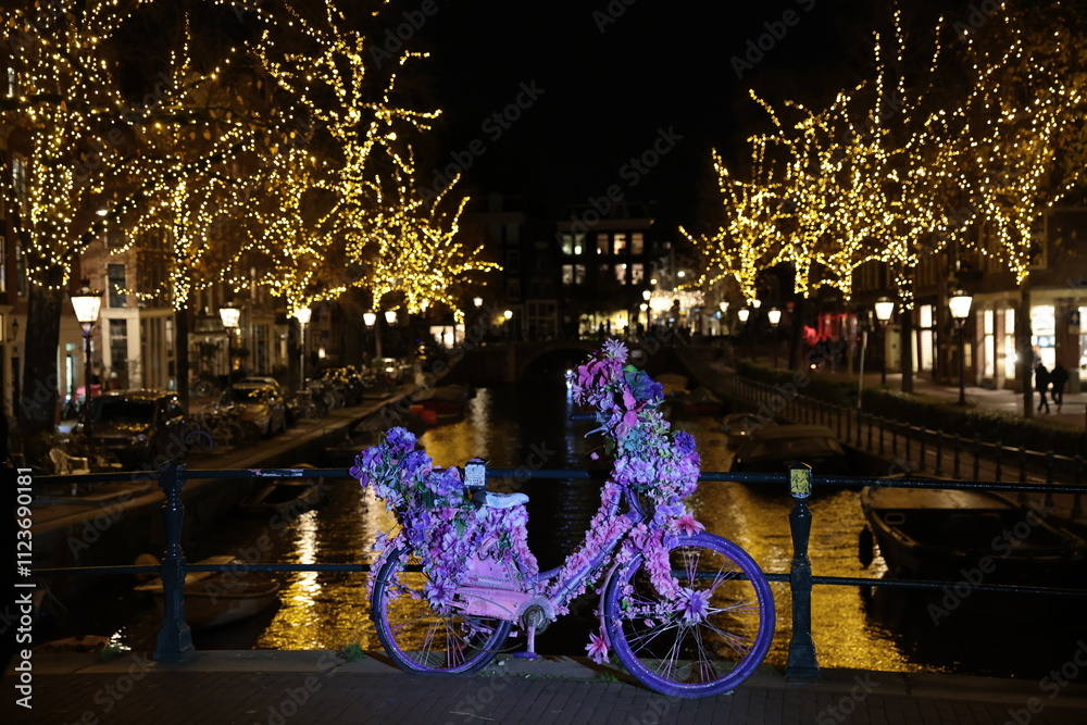 Night street with bicycle and lights in amsterdam, The Netherlands