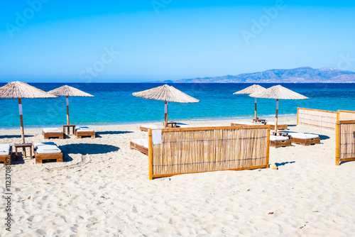 Quadro su tela Sun umbrellas on stunning Plaka beach with crystal clear sea water, Naxos island