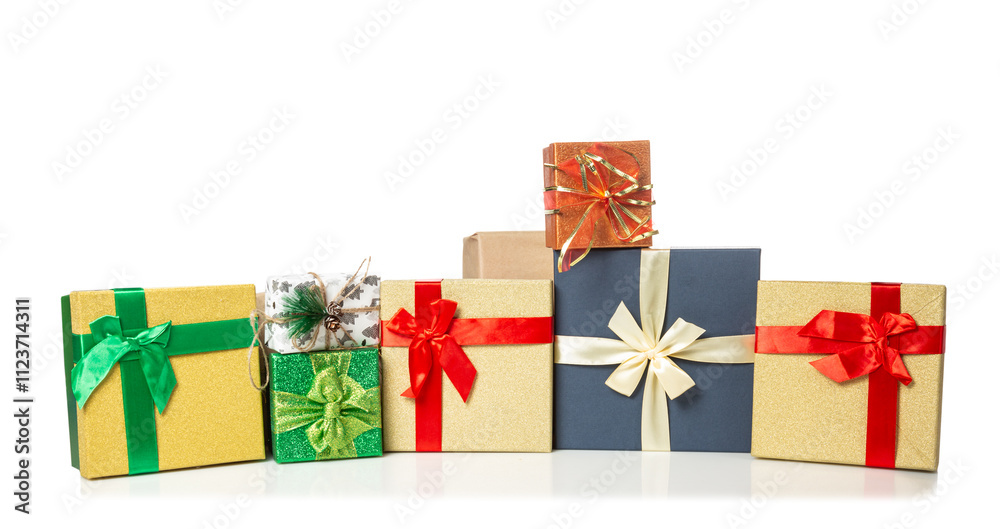 Fototapeta premium Colorful stacked gift boxes for New Year or Christmas isolated on white background