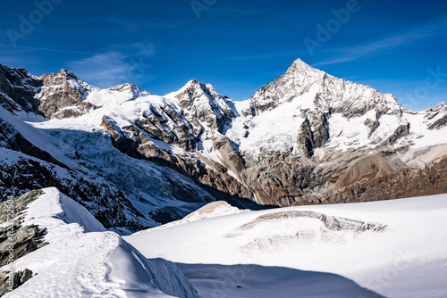 Autumn landscape of high alpine mountains in Switzerland with Matterhorn in the background