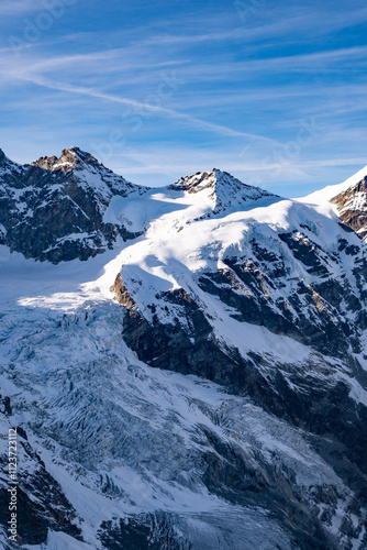 Autumn landscape of high alpine mountains in Switzerland with Matterhorn in the background