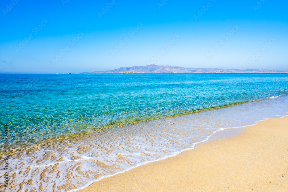 View of sandy Plaka beach and blue sea, Naxos island, Cyclades, Greece