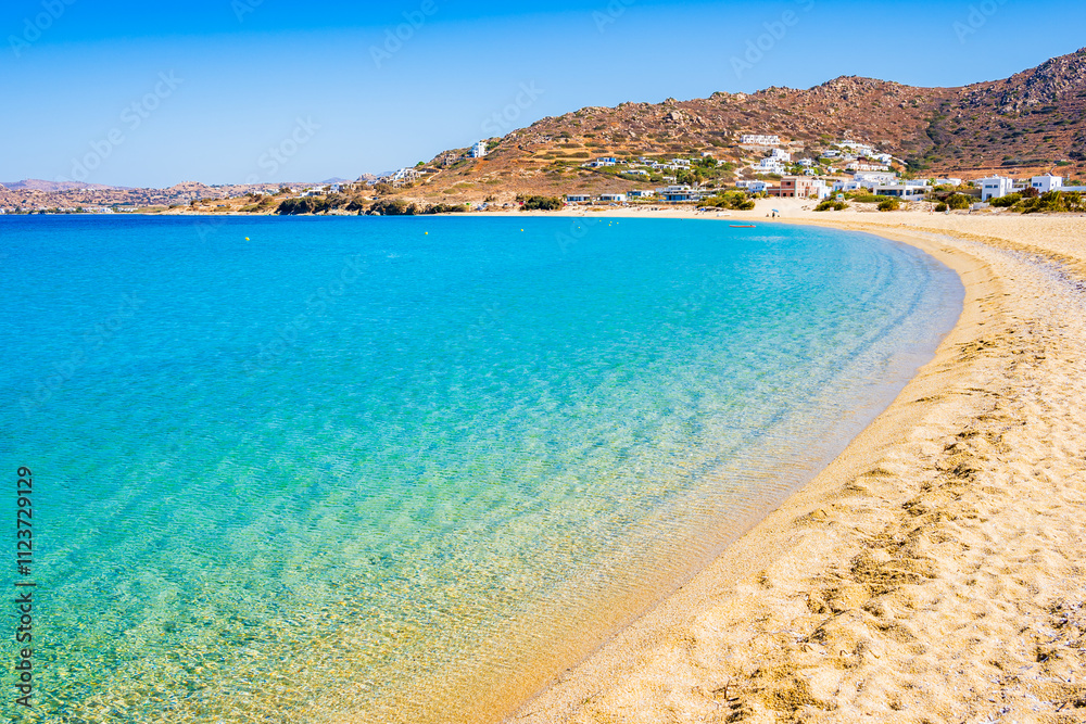 Idyllic sandy beach of Orkos bay and calm crystal clear azure sea water, Naxos island, Cyclades, Greece