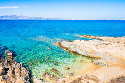 Obraz na płótnie Rocks and stones on idyllic sandy beach of Orkos bay and calm crystal clear azure sea water, Naxos island, Cyclades, Greece w salonie