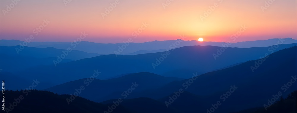 Fototapeta premium Stunning sunrise over serene mountain ranges with vibrant sky colors