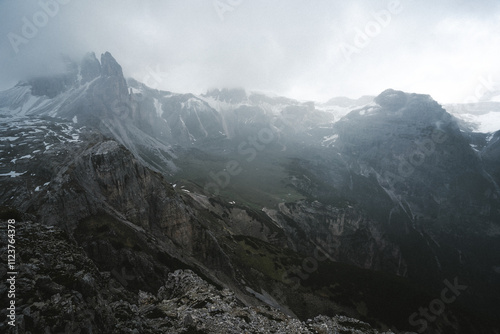 A stunning black and white photograph depicting a majestic mountain range