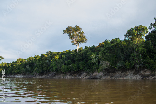 IGAPOS OF THE NANAY RIVER, BLACK WATERS THAT REFLECT THE CLOUDS ON THEIR SURFACE photo