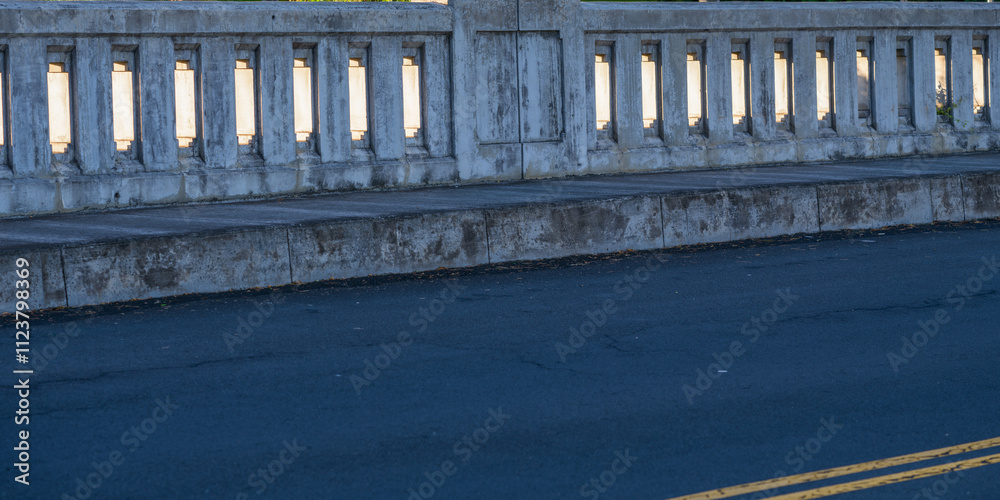 Fototapeta premium Abstract Background of a Vintage Concrete Bridge in an Asphalt Road.