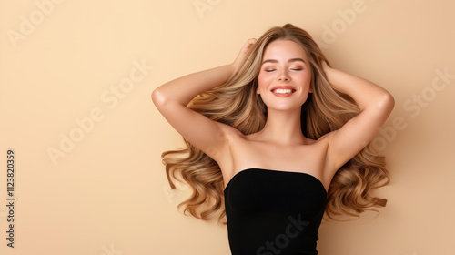 Stunning blonde woman showcases chic fashion in this vibrant studio portrait, highlighting flawless hair and makeup.