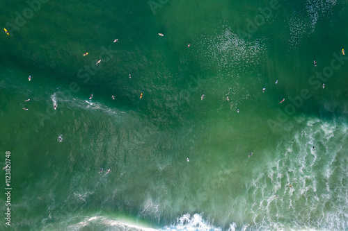 Scenic aerial views of surfers in the water at Norries Headland in Cabarita east coast of New South Wales, Australia  photo