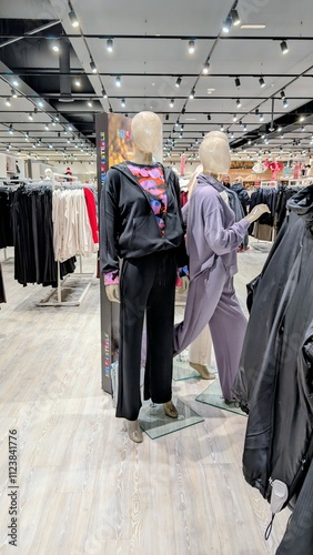 Obraz na płótnie Plastic mannequin wearing colourful clothing style at Dunnes stores, fashion and clothing shop interior w salonie