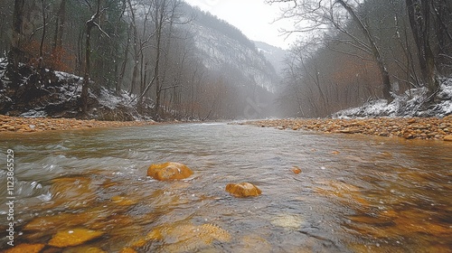 A serene river scene surrounded by trees and mountains in a misty atmosphere.