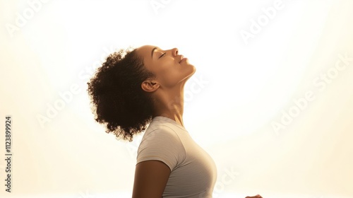 A womanon the yoga mat, white background photo