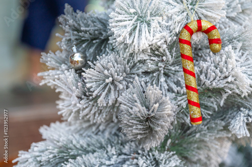 Christmas tree decorated with red and white stars and balls. Selective focus.