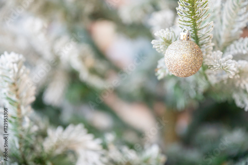 Christmas tree decorated with red and white stars and balls. Selective focus.