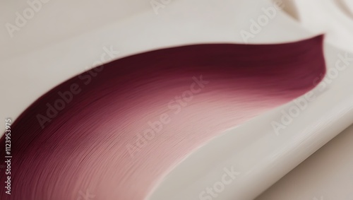 A gradient of pink and maroon paper layers curved