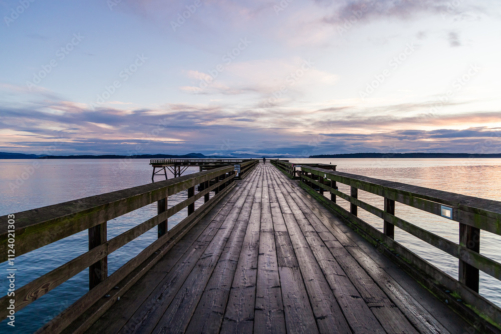 Fototapeta premium Scenic Sunrise Over Wooden Pier in Downtown Sidney, Vancouver Island, Canada