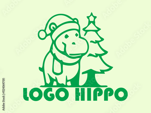 Green hippo with hat beside mini Christmas tree, perfect for holiday greeting cards, festive designs, childrens illustrations, and seasonal graphics photo