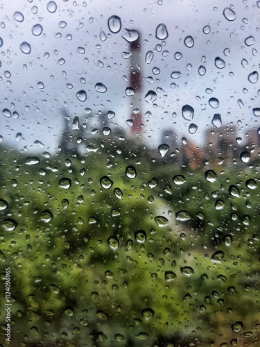 Blur bacground Rain drops on window with tower