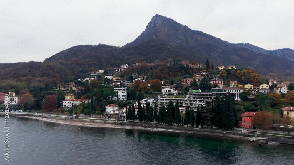 Colorful lakeside town of Lecco with hillside homes and calm waters in northern Italy Colorful lakeside town of Lecco with hillside homes and calm waters in northern Italy